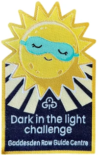 Dark in the light badge